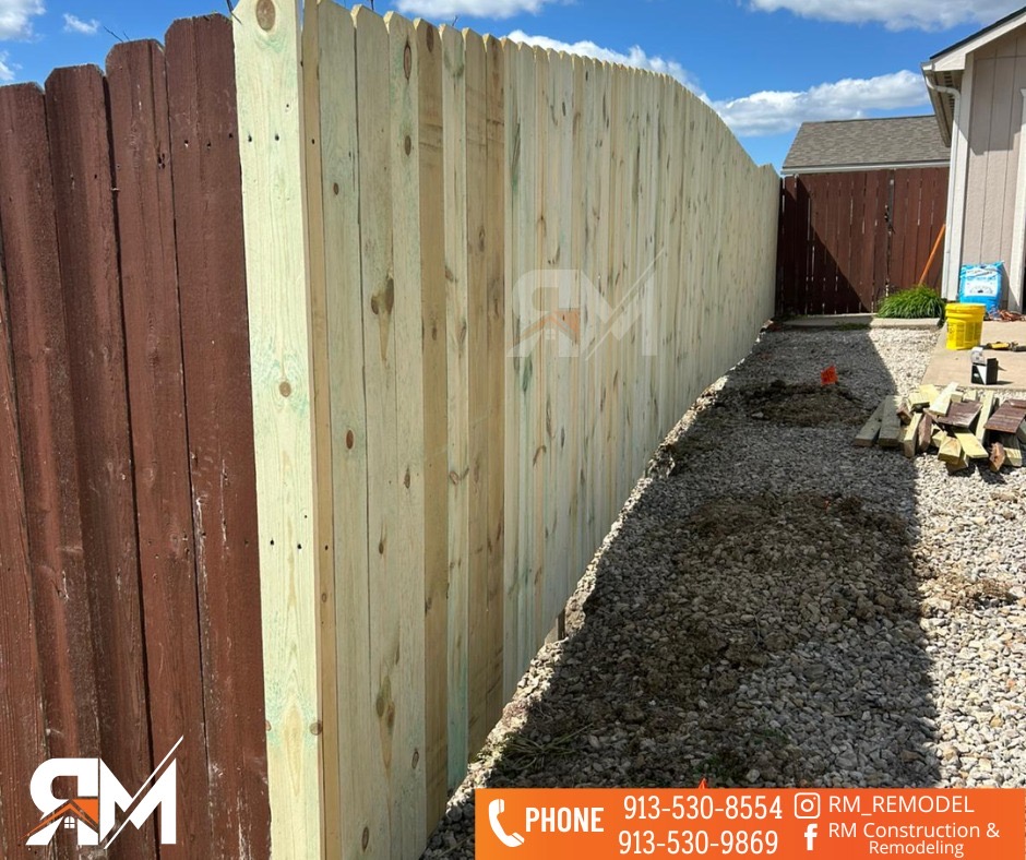 New wood fencing beside an existing fence