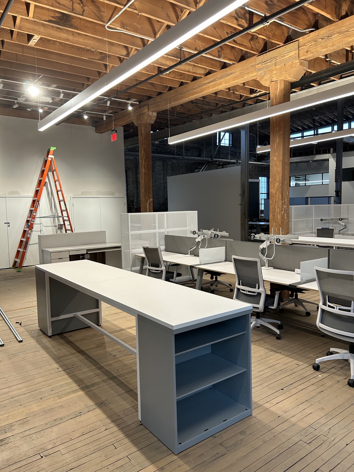 Commercial interior with open ceiling and office partitions